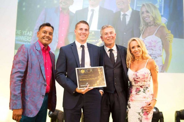 Brownlow Utilities on stage receiving their award